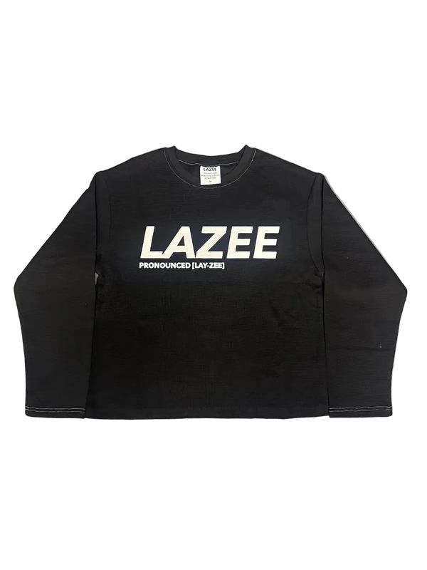 A black long-sleeve crewneck sweatshirt with 'LAZEE' printed in bold white letters and 'PRONOUNCED [LAY-ZEE]' underneath.